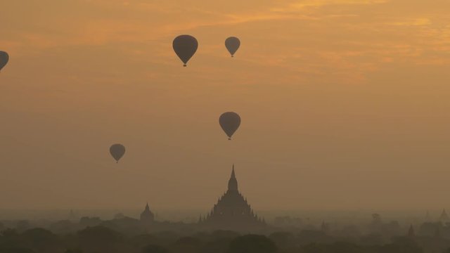 Hot air balloon over plain of Bagan at sunrise, Myanmar 