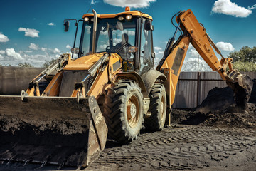 Yellow excavator operation, close-up