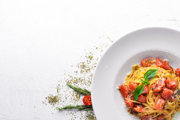 Pasta tomatoes. Italian traditional food. On a wooden background. Top view. Free space for your text.