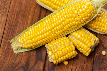 fresh corn on wooden table