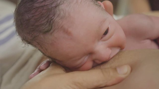 bew born baby caucassian happy breast feeding