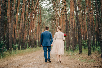Fototapeta premium Lovers in the Pine Forest