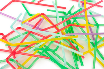 Colorful drinking straws on white background
