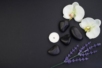 Obraz na płótnie Canvas Spa/wellness concept. Zen stones with orchids top view. Flatlay. 