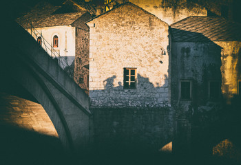 people silhouette on medieval stone house wall, Mostar, Bosnia and Herzegovina, vintage, concept