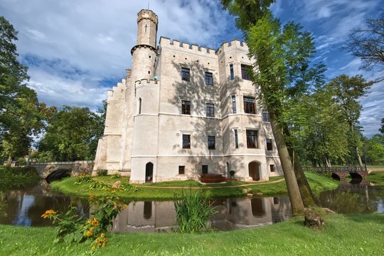 Neo-Gothic style castle surrounded by a moat in Karpniki, Poland