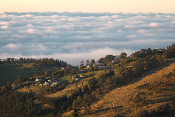 Sunset above clouds