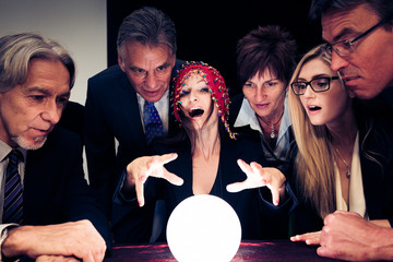 Business Team Using A Crystal Ball To Look Into Future