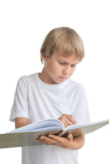 Boy with notebook and pen writing something, isolated on white background.