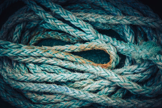 Background texture of coiled marine or nautical rope.Texture of synthethic mooring line. Close up