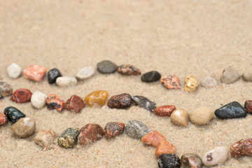 pebble  wave pattern on sand selective focus