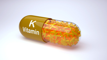 Yellow pill or capsule filled with vitamin K. 