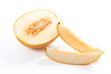 Sliced honeydew melon tropical fruit isolated on a white background.