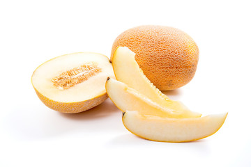 Whole, half and sliced honeydew melon tropical fruit isolated on a white background.