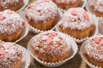 Cupcakes, muffins on a wooden table