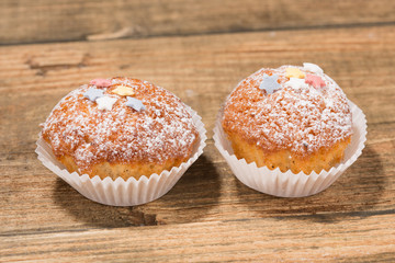 Cupcakes, muffins on a wooden table