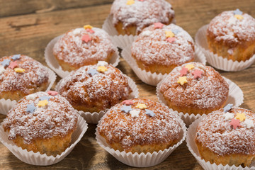 Cupcakes, muffins on a wooden table