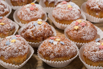 Cupcakes, muffins on a wooden table
