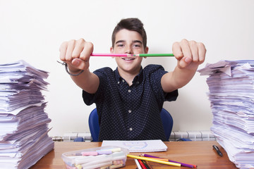 child at school studying at the desk