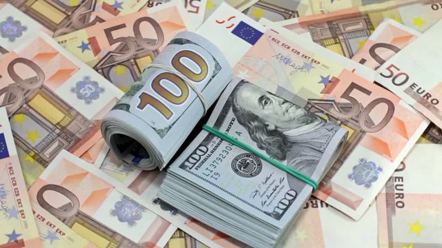 Rotating Hundred Dollar And Euro Banknotes