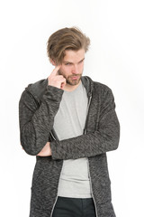 man with beard on thoughtful face in grey sportswear