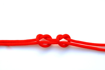 The two ropes tied into two hearts, it is a symbol of good relationships.