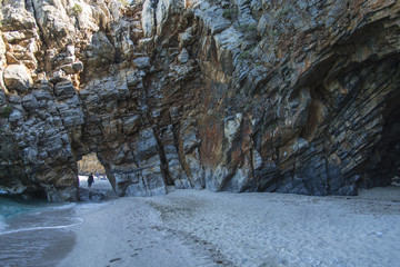 Fototapeta na wymiar Arched passage ,Mylopotamos beach, Pelio, Greece