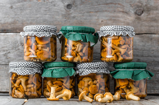 Food In Jar, Marinated Mushrooms On Rustic Wooden Table, Home Made Preserves In Cellar