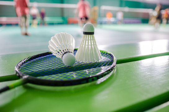 shuttlecock on badminton racket.