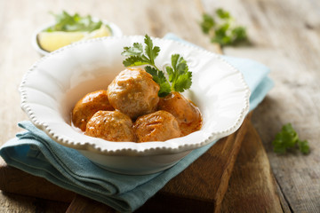 Meatballs in tomato and sour cream sauce