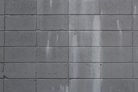 Grey Cinder Block Wall With Paint Stains
