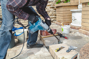 Construction Hammer destroying brickwork