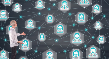 Businessman presenting a social network concept on a wall screen