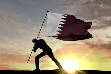 Qatar flag being pushed into the ground by a male silhouette. 3D Rendering