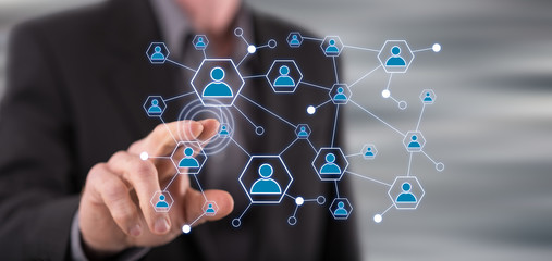 Man touching a social network on a touch screen