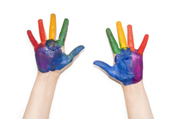 Children's hands painted with colorful paint.
