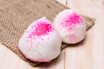 Two steamed bun (Chinese Buns) on wood background