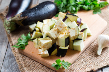 Eggplant cubes on a cutting board