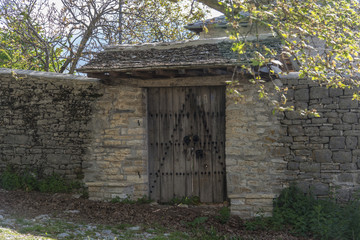 Rustic entrance door in greek village