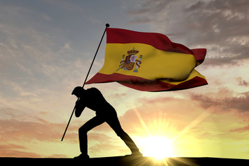 Spain flag being pushed into the ground by a male silhouette. 3D Rendering
