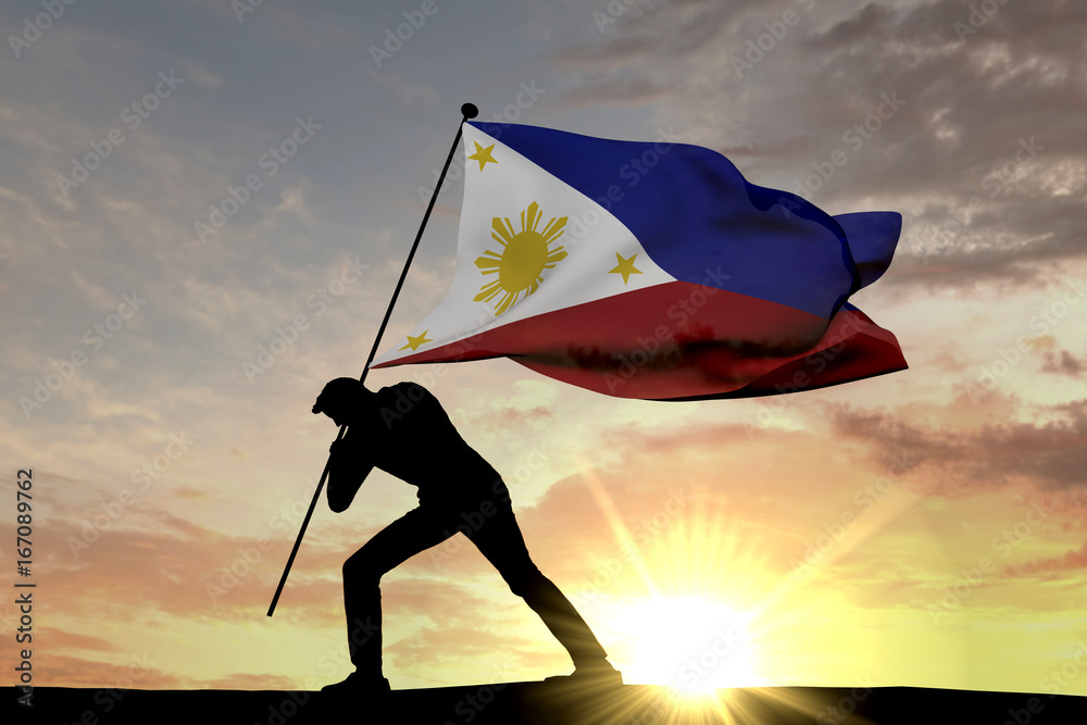 Wall mural philippines flag being pushed into the ground by a male silhouette. 3d rendering - Wall murals