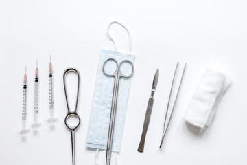 instruments for plastic surgery on white background top view