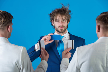 Men wearing white jackets, back view