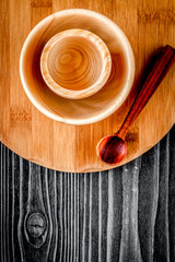 wooden kitchen utensils on dark background top view