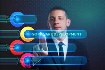 Business, Technology, Internet and network concept. Young businessman working on a virtual screen of the future and sees the inscription: Software development