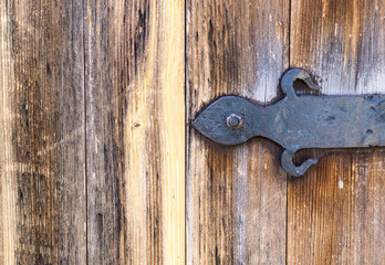 wooden gate shutter with iron loops. background, vintage.