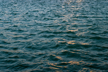 Reflection of sunset in the waves of the uneasy Black sea