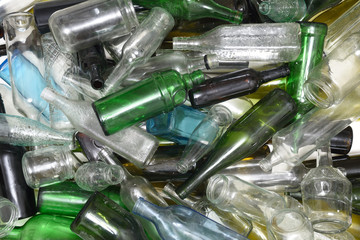 Glass bottles inside a glass recycling container