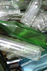 Glass bottles inside a glass recycling container