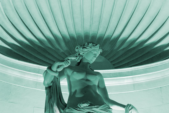 Marble Statue of Tethys Illuminated at Night in Trieste, Italy